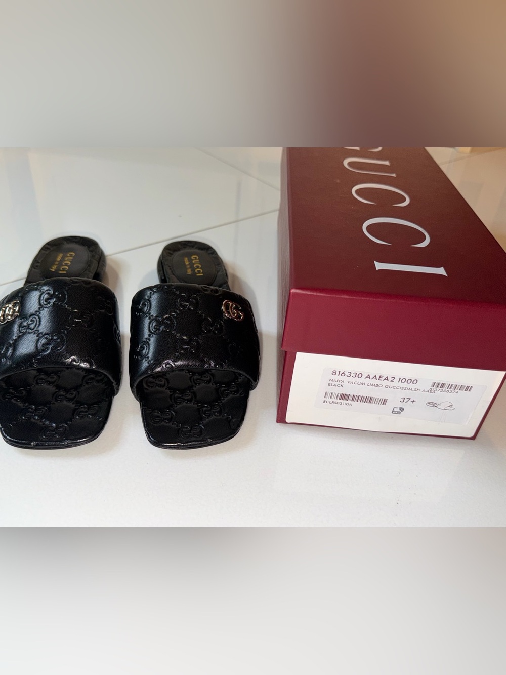 Gucci Black Embossed GG Slide with Gold Double G Accent
